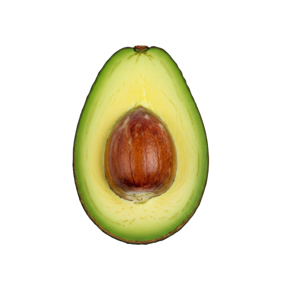 Fresh avocado half with pit used in Celeste Switala skincare products