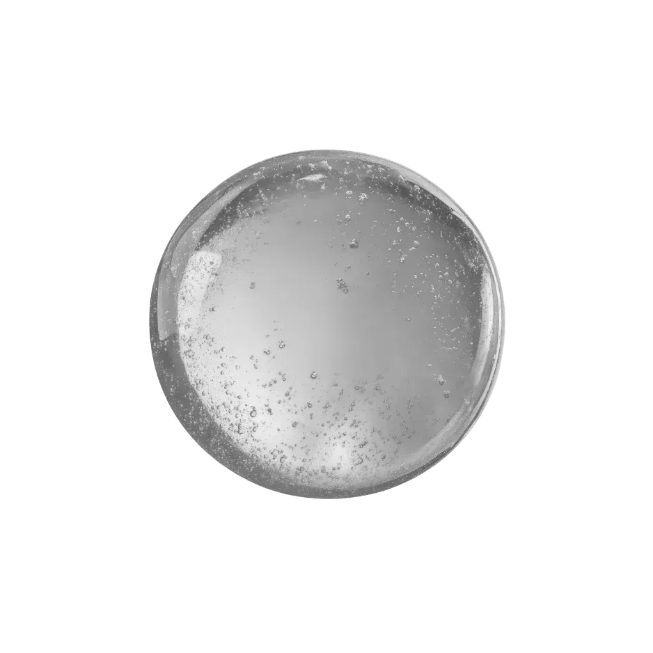 Black and white close-up of astaxanthin extract with a smooth liquid texture and visible bubbles.