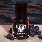 Blissed Out Balancing Face Oil 50 ml bottle displayed with fresh blueberries