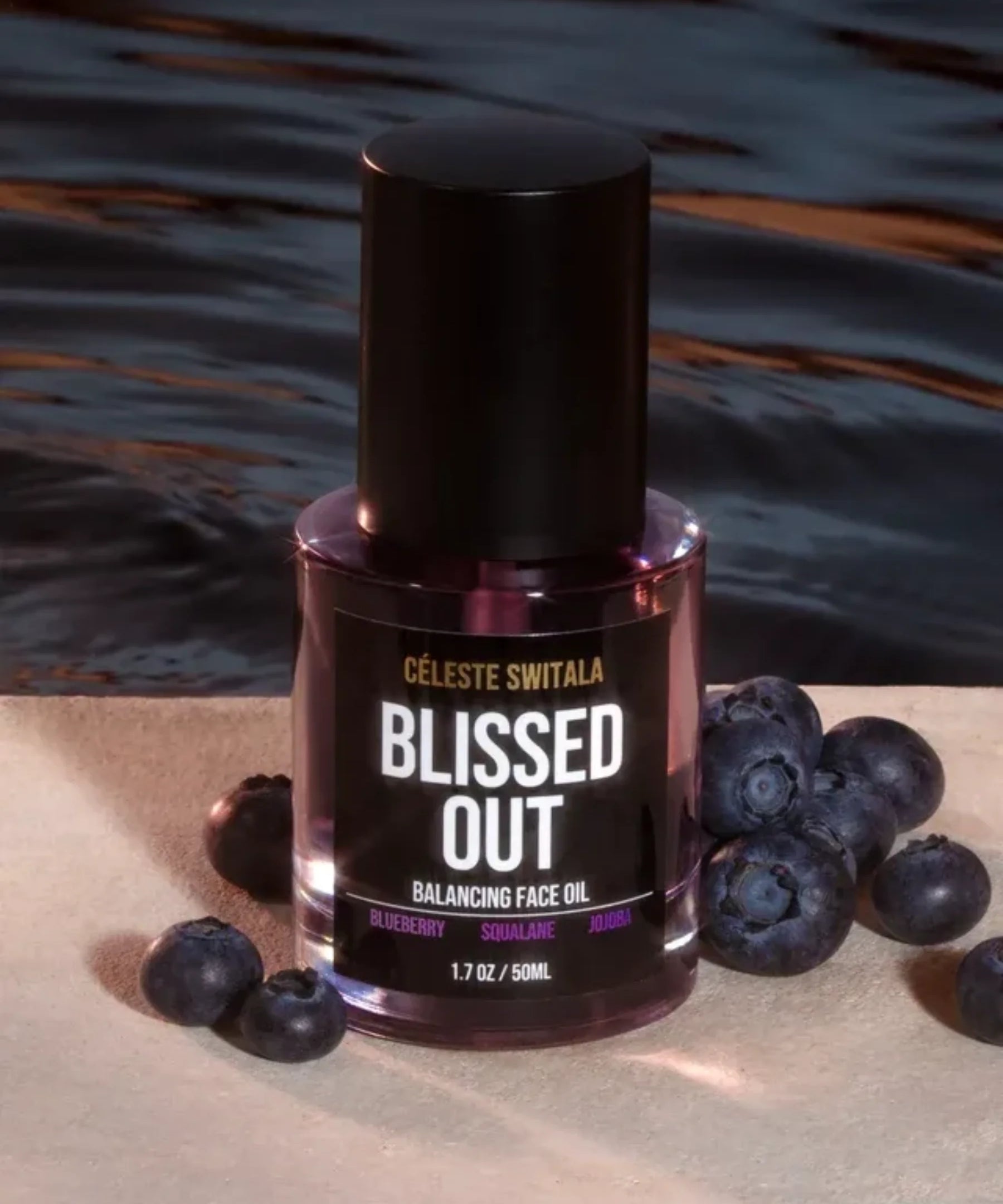 Blissed Out Balancing Face Oil 50 ml bottle displayed with fresh blueberries