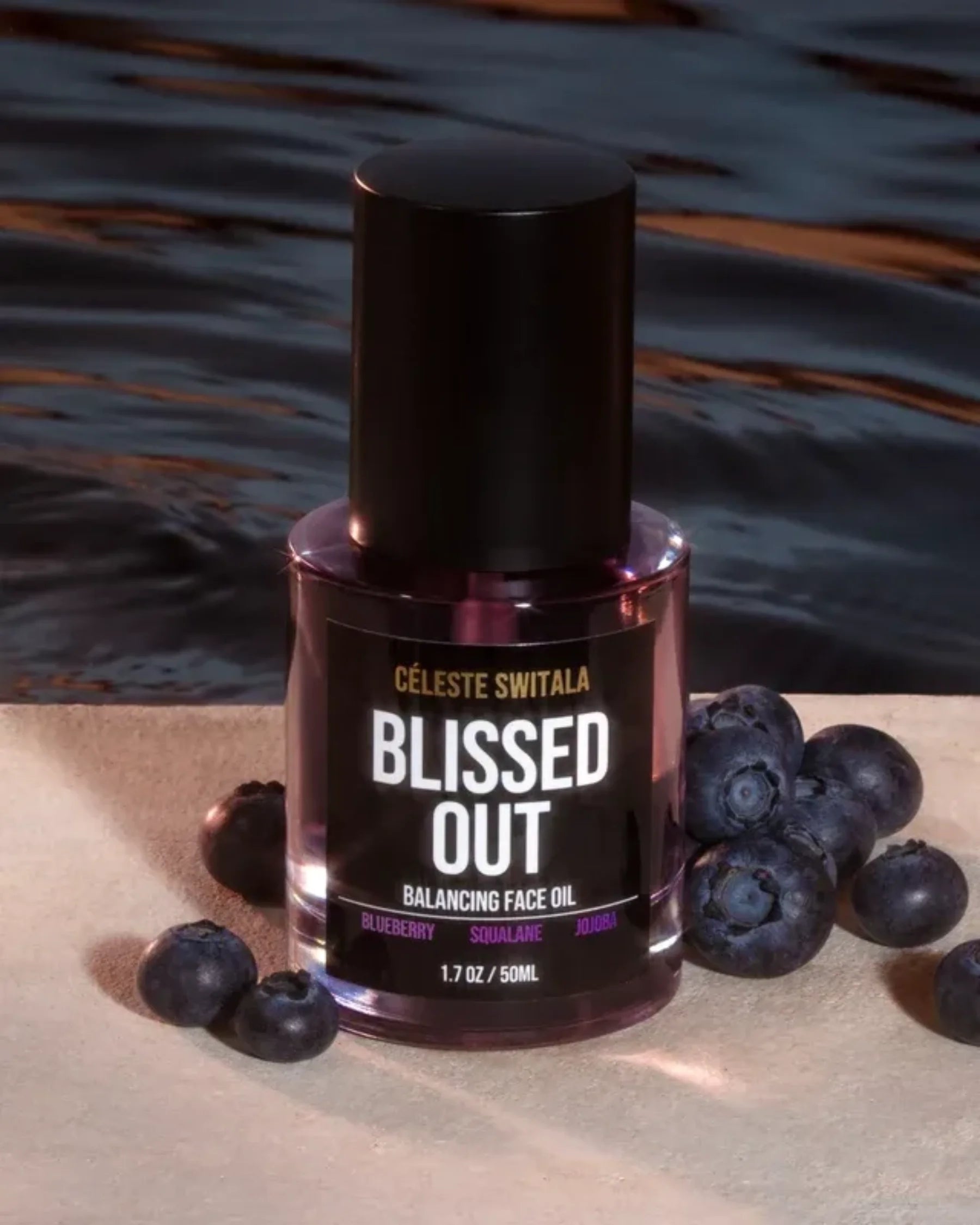 Blissed Out Balancing Face Oil 50 ml bottle displayed with fresh blueberries