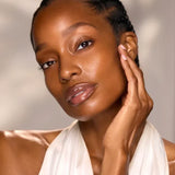 Woman with radiant, healthy-looking skin for Blissed Out Balancing Face Oil