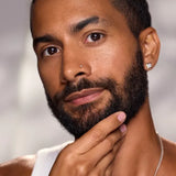 Model with a groomed beard demonstrating men's beard and facial care