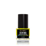 Man holding Céleste Switala Filthy Rich Reviving Face Oil beside his face