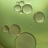 Botanical face oil droplets showing the lightweight texture of Céleste Switala grooming oil