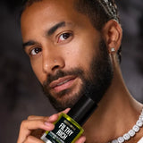Model holding Céleste Switala Filthy Rich Reviving Face Oil by Jordan Liberty