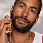 Man grooming his beard in Céleste Switala Filthy Rich Face Oil campaig