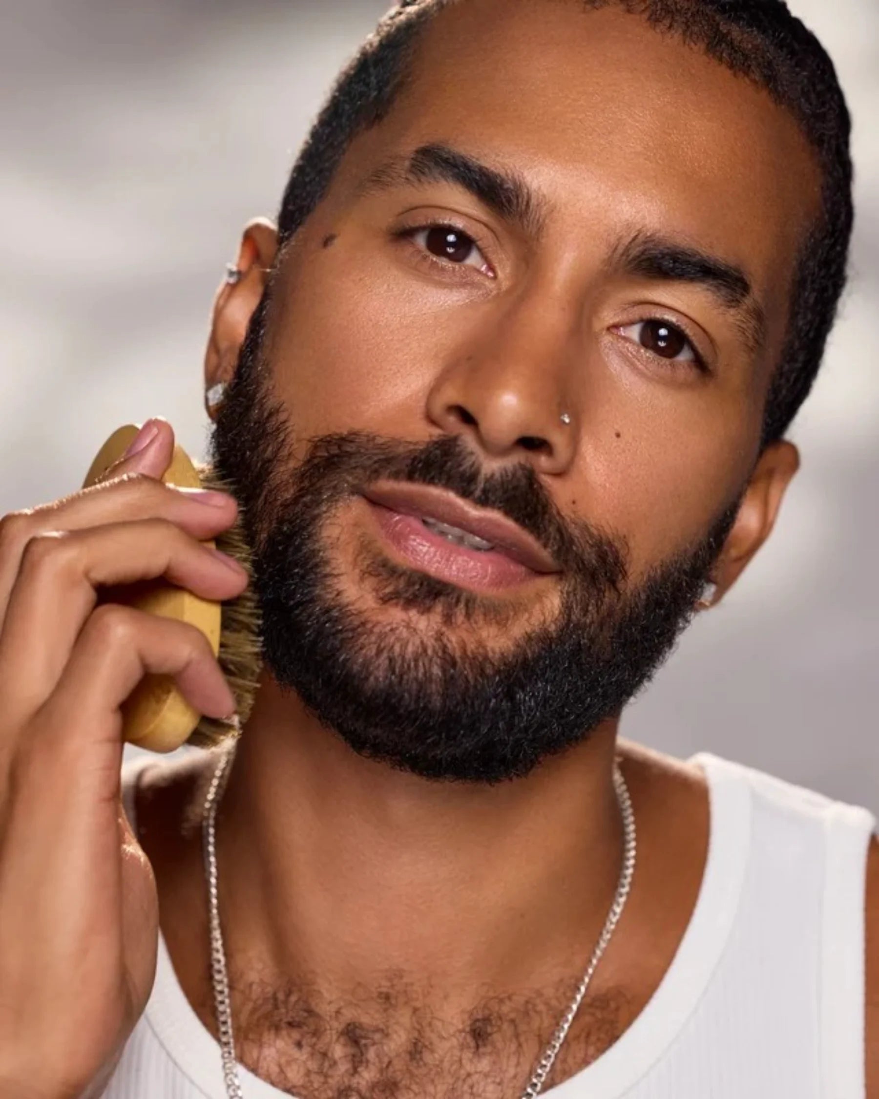 Man grooming his beard in Céleste Switala Filthy Rich Face Oil campaig