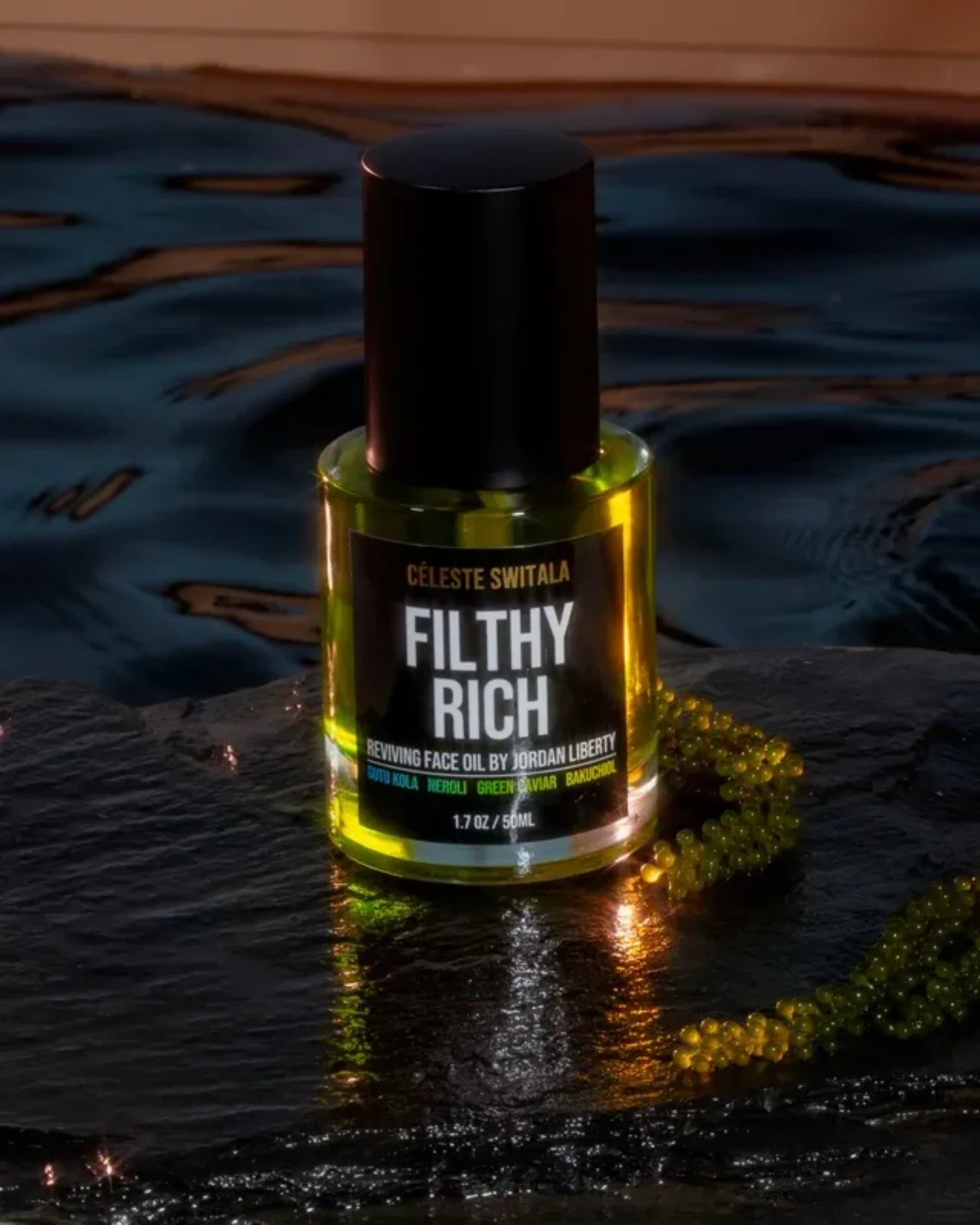 Filthy Rich Reviving Face Oil displayed with green caviar botanical ingredients