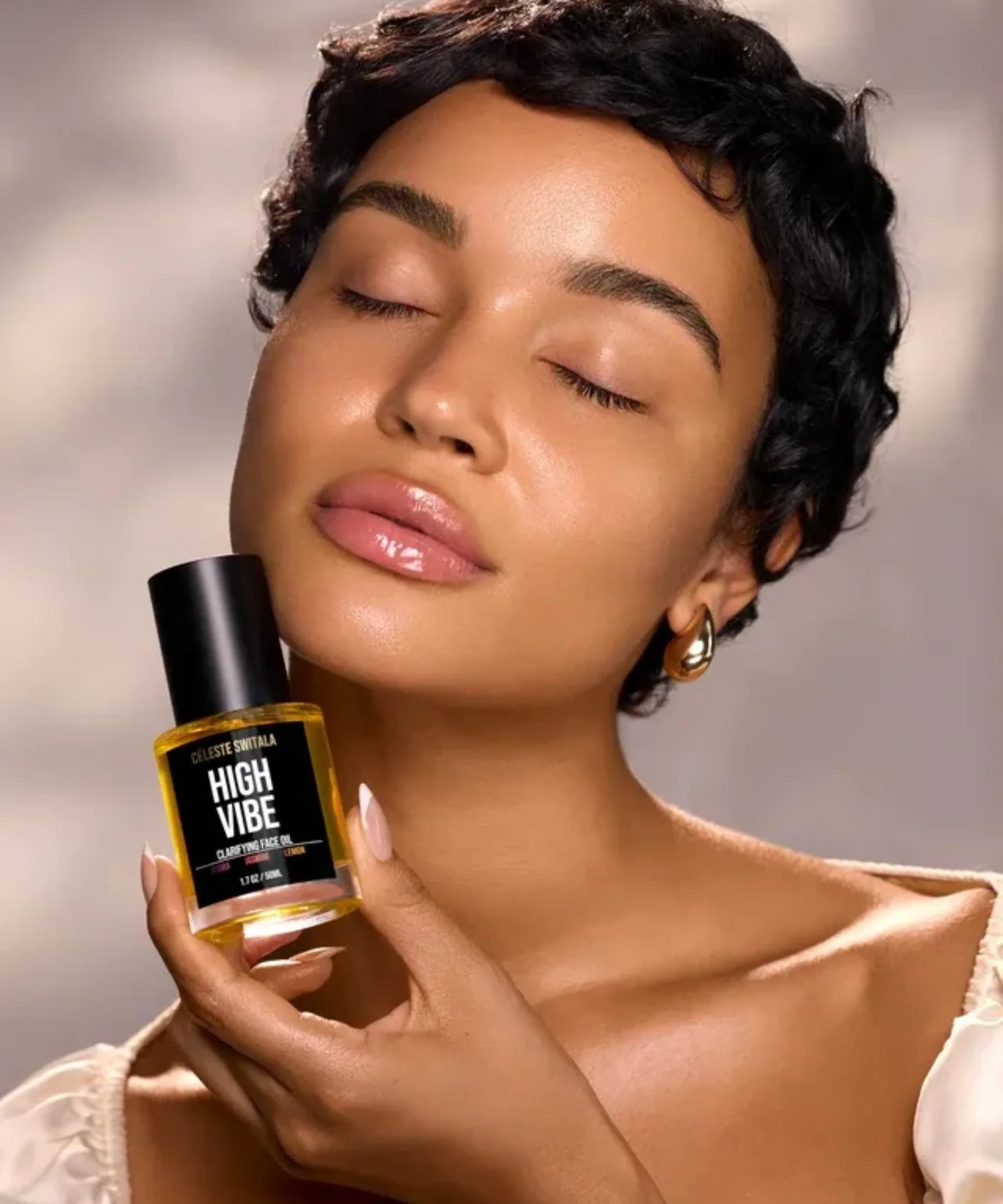 Model holding Céleste Switala High Vibe Clarifying Face Oil