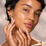 Close-up of model with luminous skin for High Vibe Clarifying Face Oil