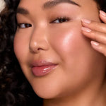 Woman with luminous glowing skin showcasing Infinite Icon Nourishing Face Oil skincare results