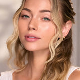 Woman with radiant skin in the Céleste Switala Naked Glow skincare campaign