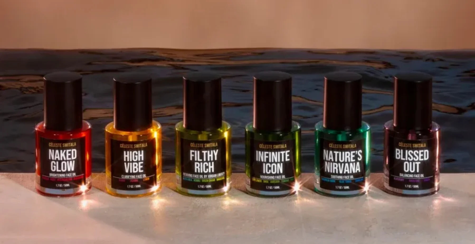 Six Céleste Switala face oils from the Full Collection Discovery Set displayed by the water